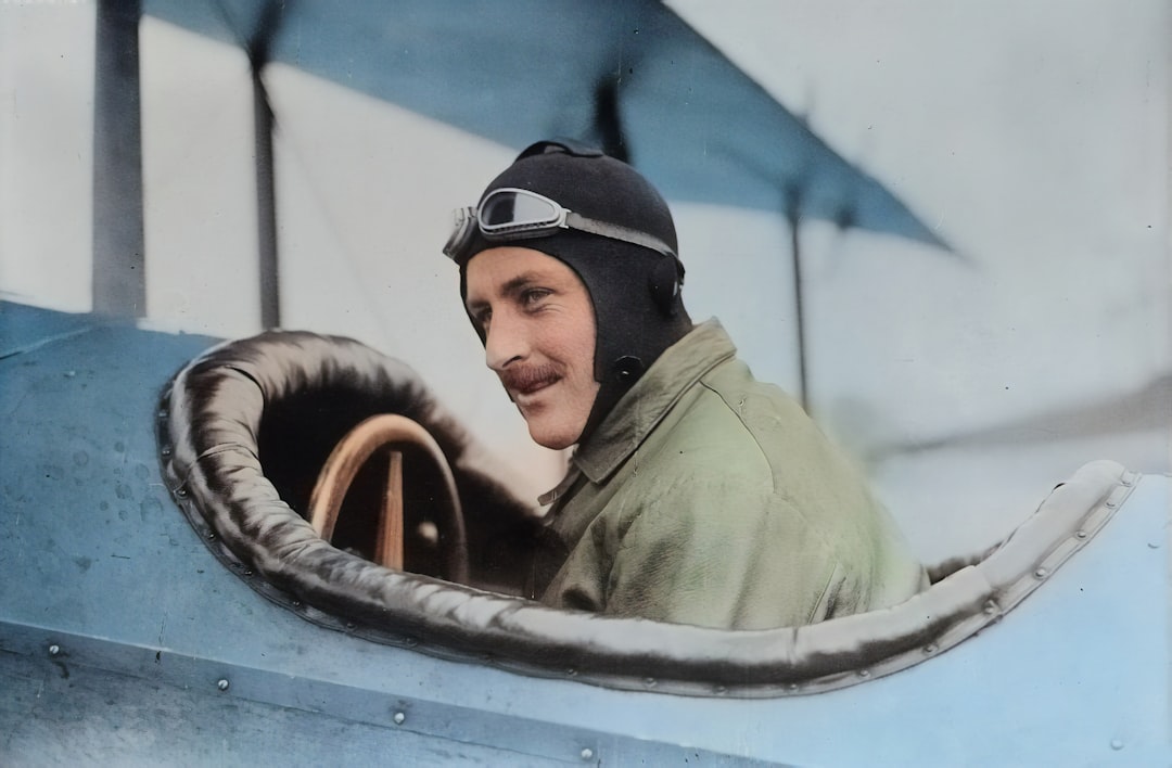 man inside biplane